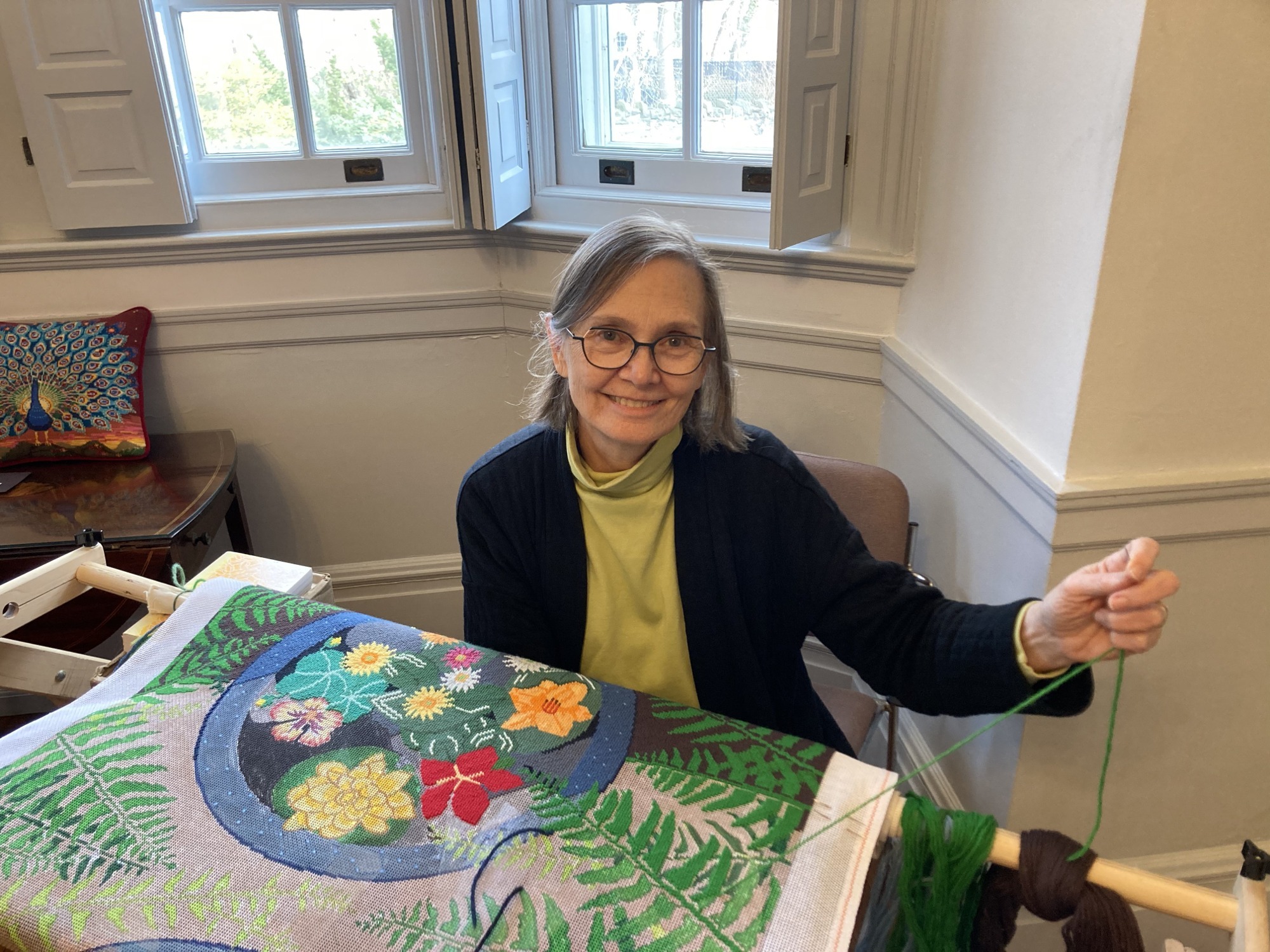 Martha is working on her hallway runner, based on flowers at Chanticleer, as part of the 2023 Spring Art Show.